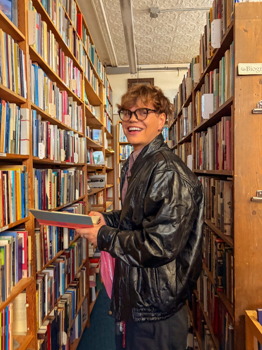 Justin browsing a bookstore